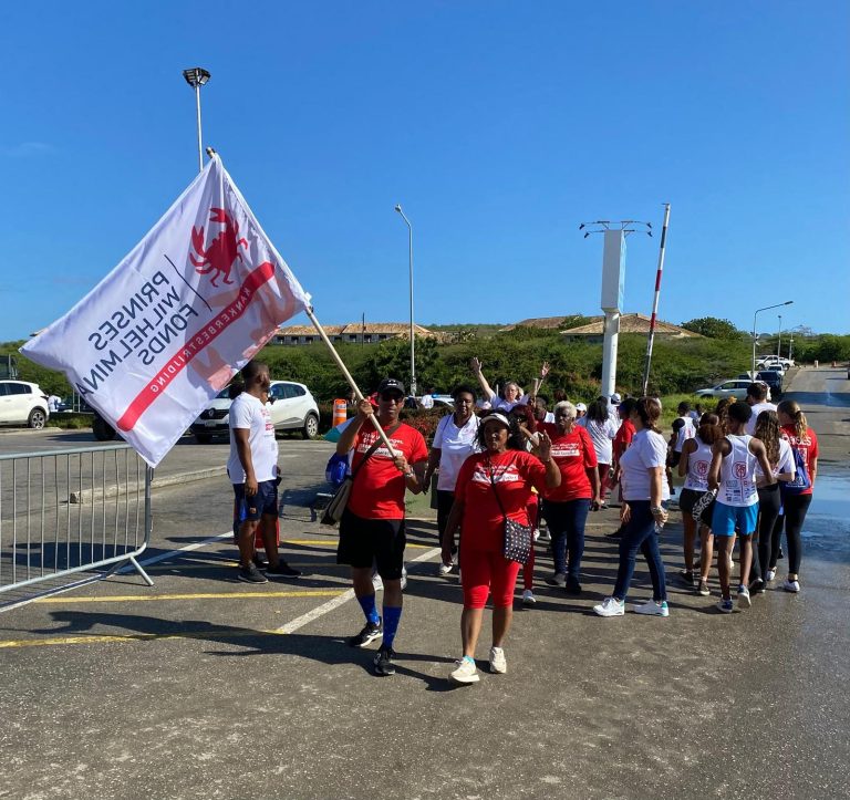 Participants setting off behind the PWF flag at Ride for the Roses 2026