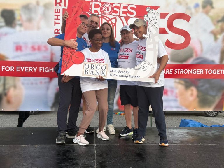 Organisers and Orco Bank representatives at the Ride for the Roses 20th edition photo frame